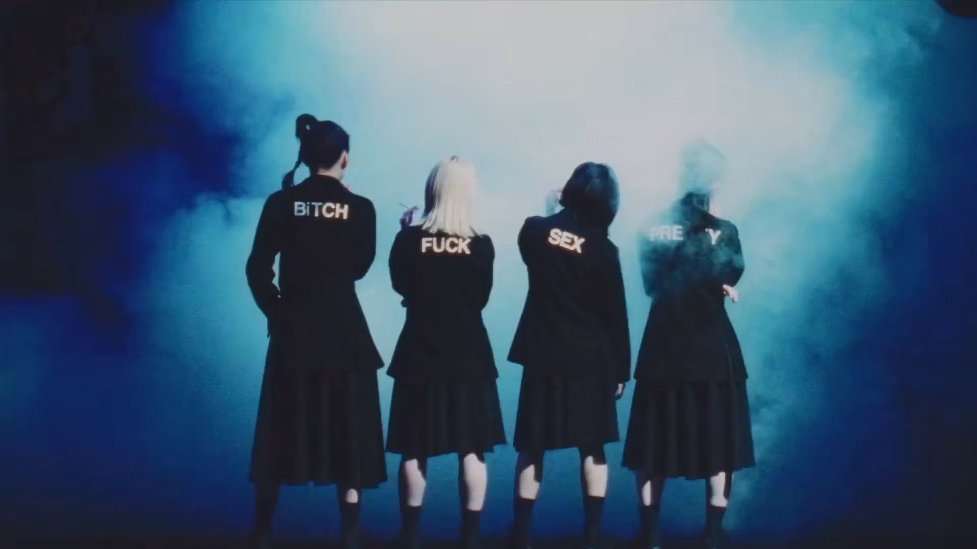 Las cuatro chicas de BiS (3° generación) usando vestidos negros, de espaldas a la cámara, en un cuarto lleno de humo (una de ellas fumando), y en la espalda de sus vestidos cada una tiene estampada una de las siguientes palabras: 'BiTCH', 'FUCK', 'SEX' y 'PRETTY'